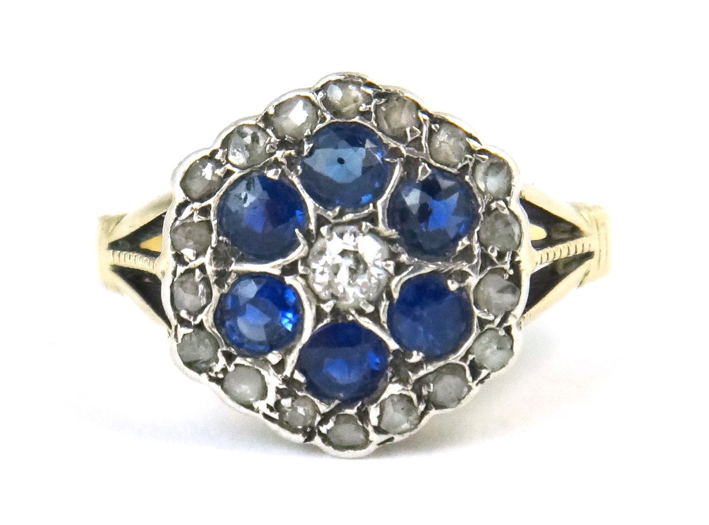 Appraisal: A gold diamond and sapphire set hexagonal cluster ring mounted