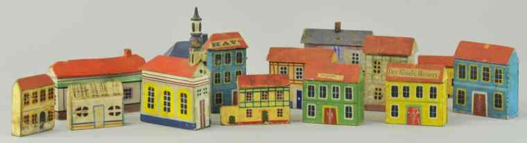 Appraisal: SMALL WOODEN VILLAGES Hand painted assorted houses and buildings well