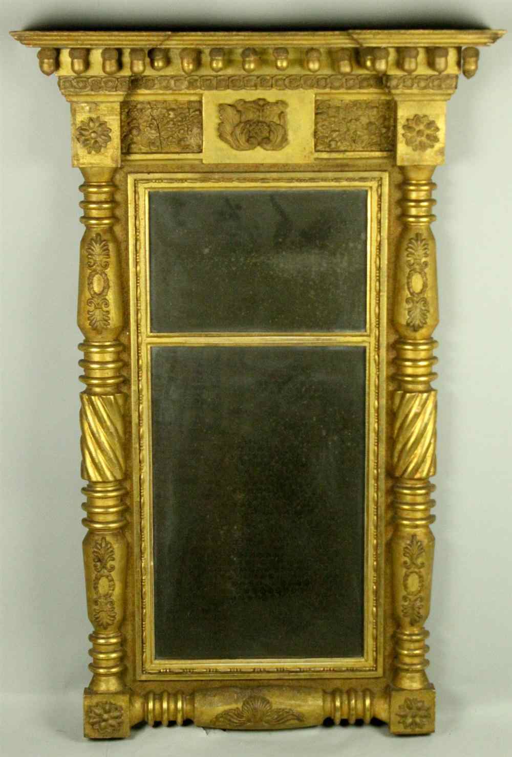 Appraisal: CLASSICAL CARVED GILT MIRROR having molded top with outset corner