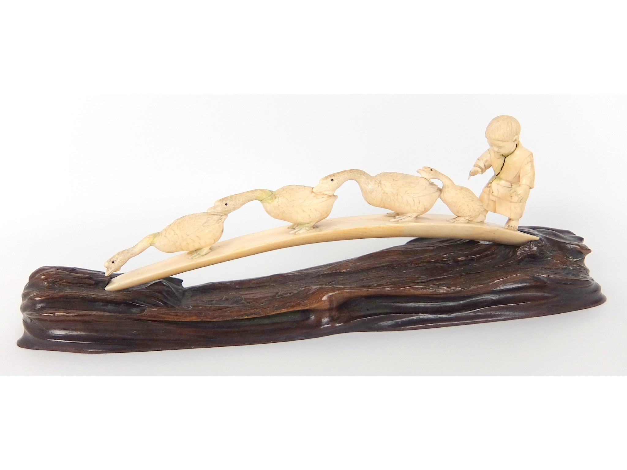 Appraisal: A Japanese carved ivory tuskwith a young boy and four