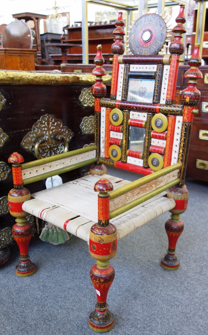 Appraisal: A pair of Indian polychrome painted mirror backed occasional chairs