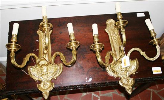 Appraisal: Pair bronze three-light sconces scrolling arms with candleholders on backplate