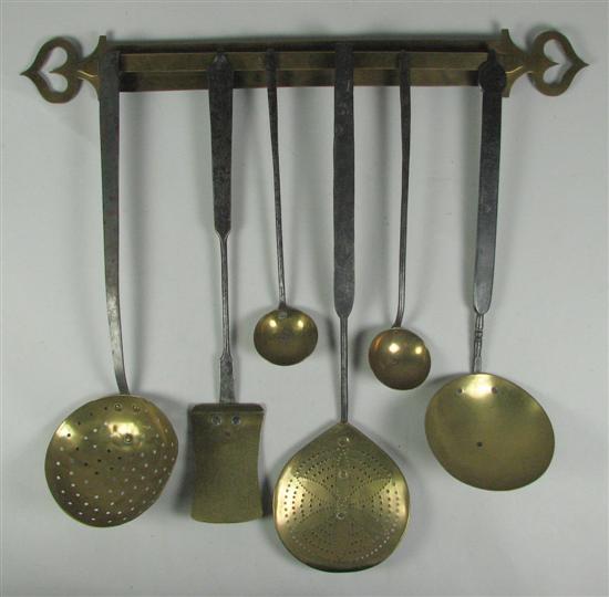 Appraisal: Brass Utensil Hanger Utensils th Century long hanger with heart