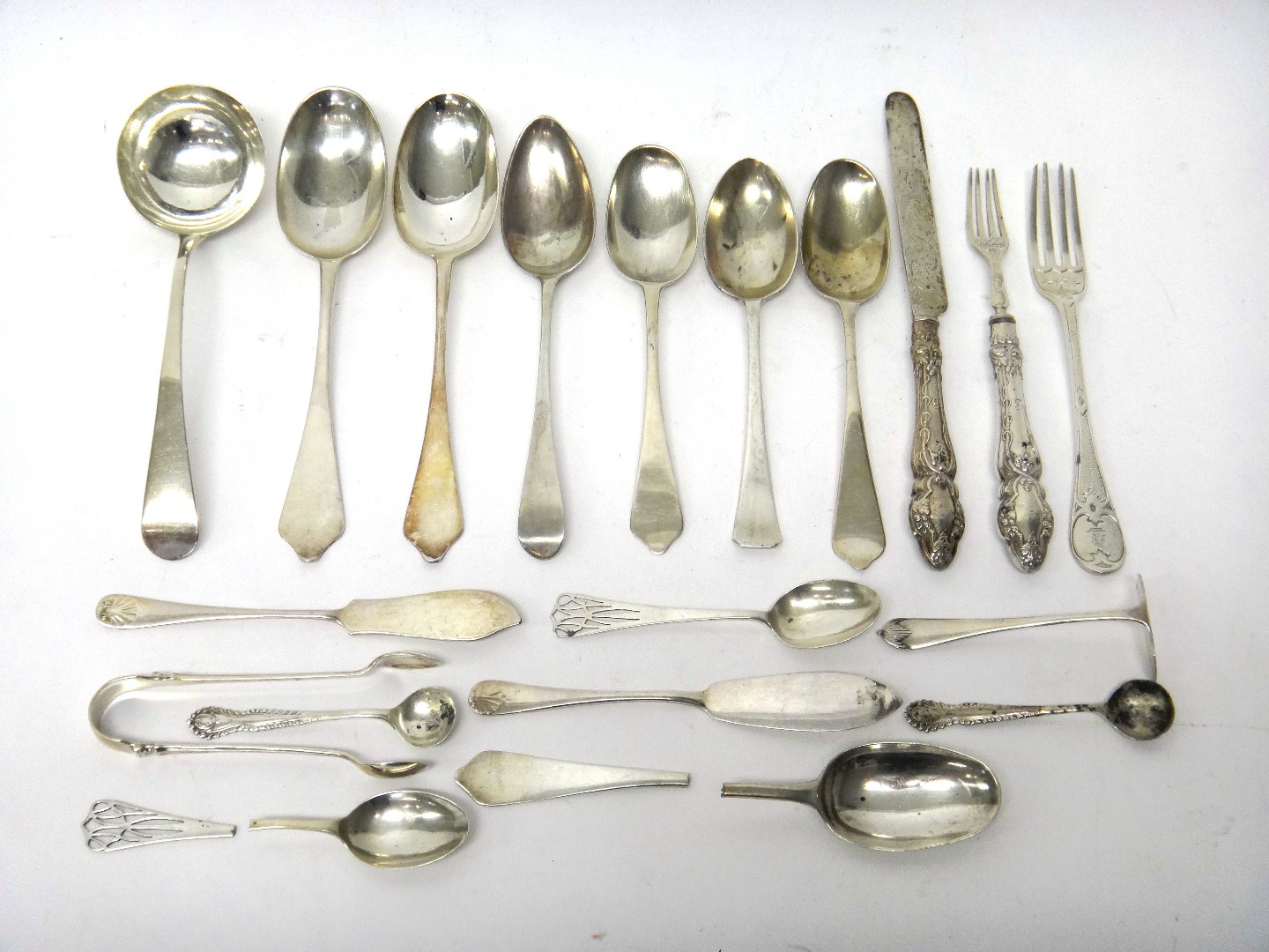 Appraisal: Silver table flatware comprising an Old English pattern sauce ladle