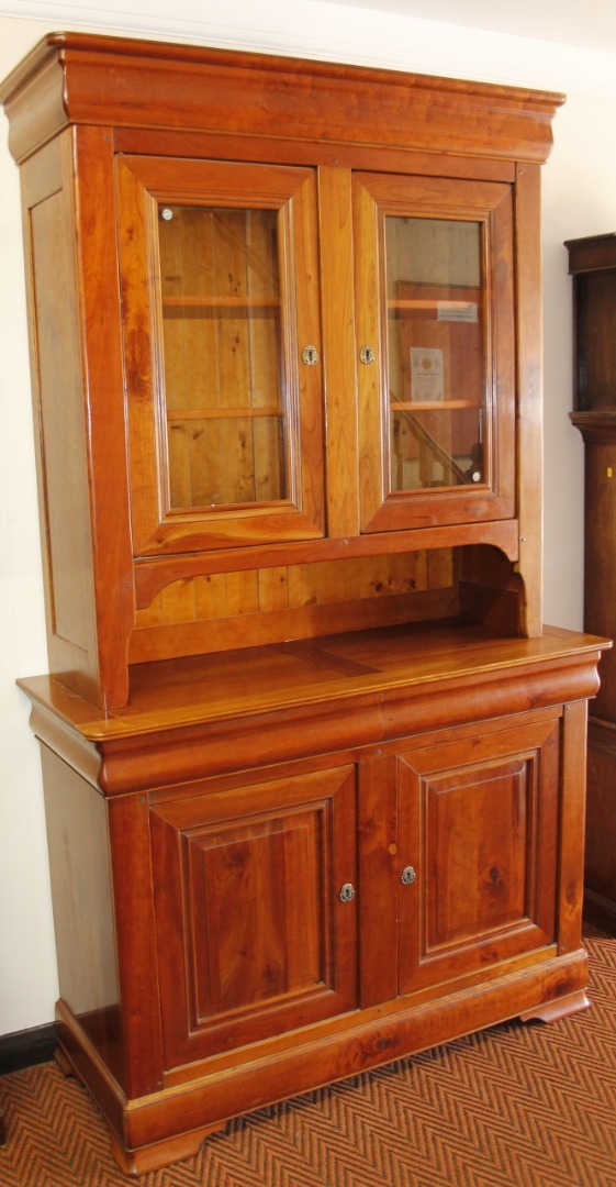 Appraisal: A modern yew wood mahogany and walnut finish display cabinet