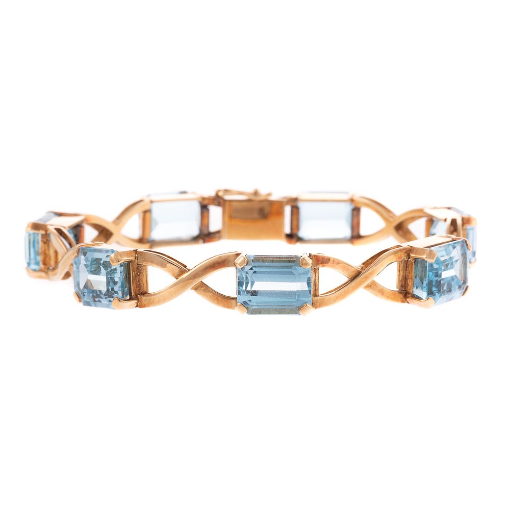 Appraisal: A Blue Topaz X Link Bracelet in K K yellow