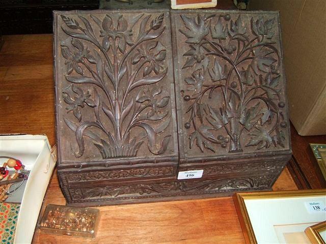 Appraisal: A Victorian walnut correspondence box with deeply carved floral decoration