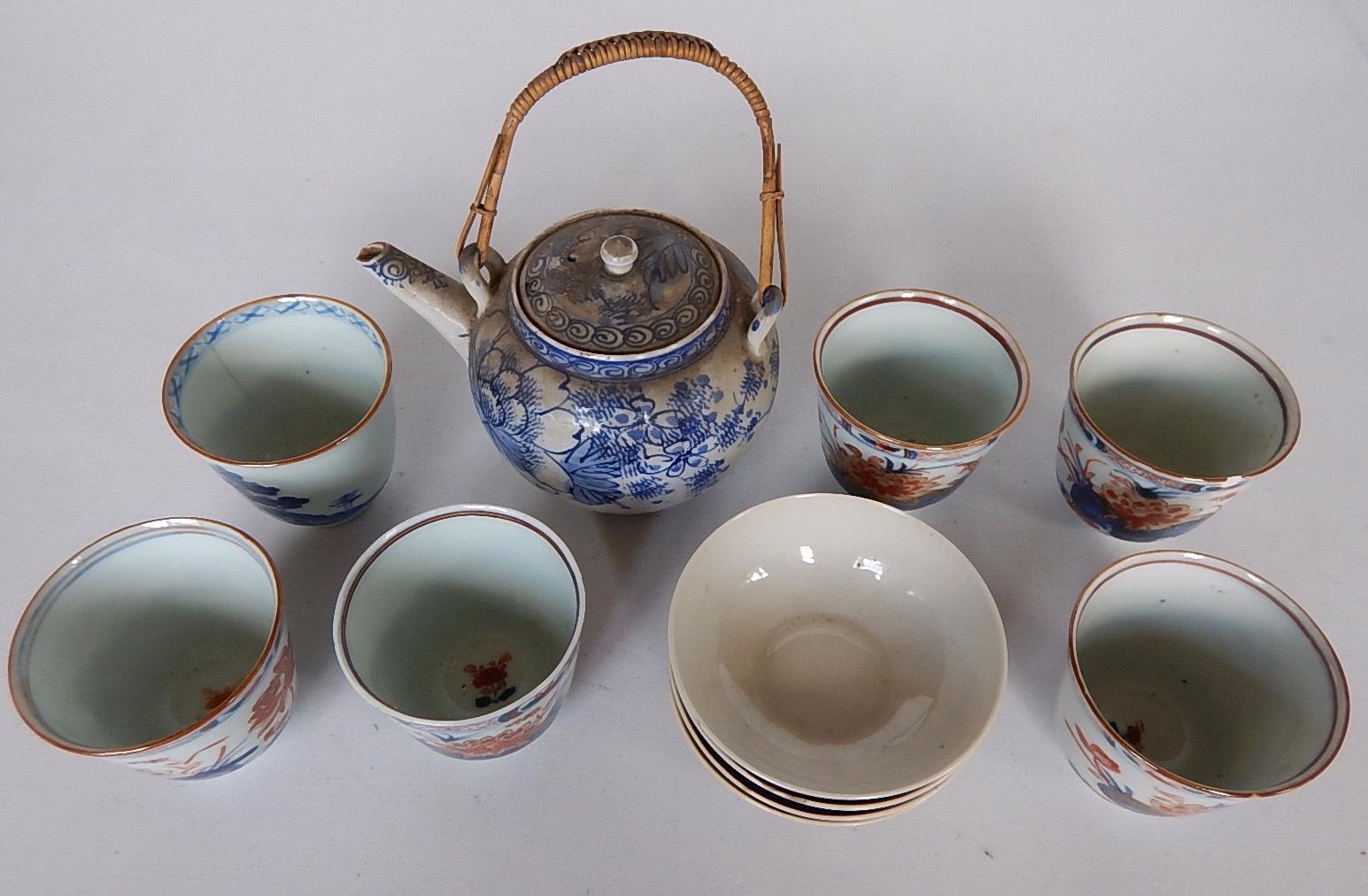 Appraisal: A blue and white hand painted Sake pot four Chinese