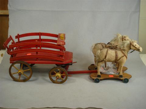 Appraisal: Horse drawn wooden delivery wagon felt covered horses on wheeled