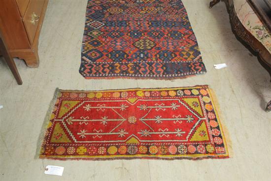 Appraisal: TWO RUGS A polychrome runner with geometric design '' x