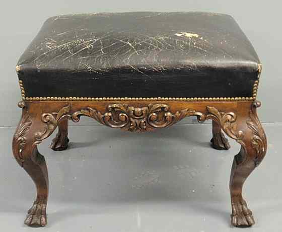 Appraisal: Chippendale style carved fruitwood stool with leather top h top