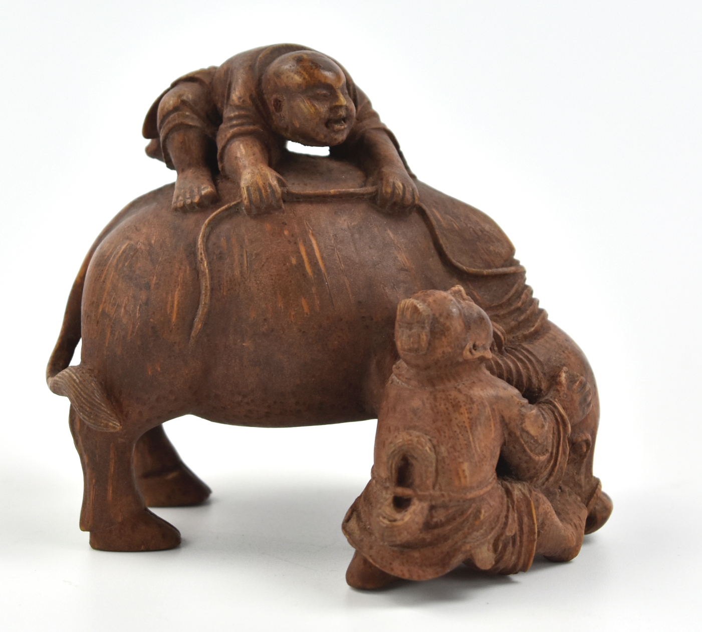 Appraisal: sculpture of a carved bamboo buffalo with two boy figures