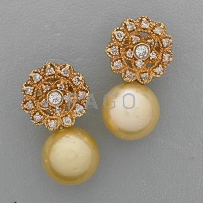 Appraisal: GOLDEN SOUTH SEA PEARL DIAMOND EARRINGS Floriform k yg diamond