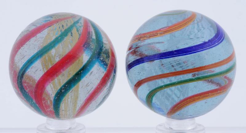 Appraisal: Lot Of Large Latticino Swirl Marbles The smaller has a