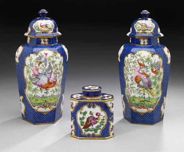 Appraisal: A pair of French porcelain covered vases and a teapoy