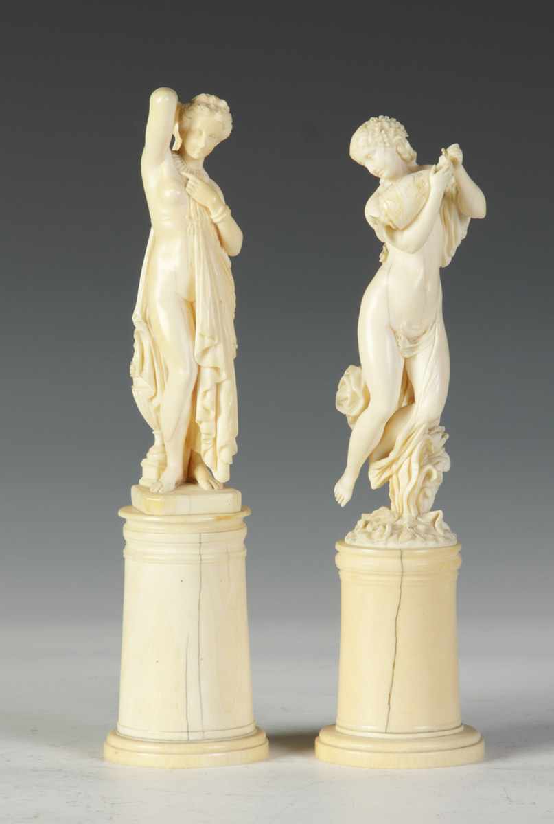 Appraisal: Pair of th Cent Carved Ivory Classical Women Condition Some