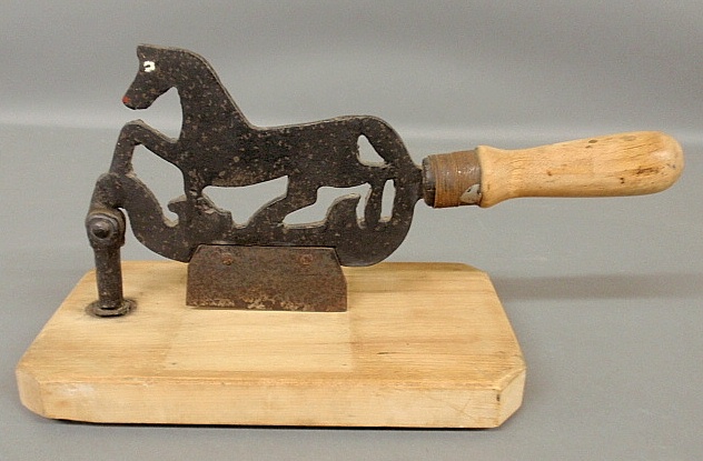 Appraisal: - Maple and wrought iron trotting horse-form chopping block h