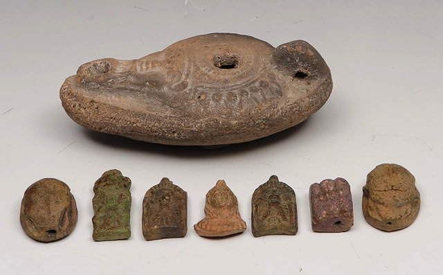 Appraisal: A ROMAN CRUZIE OIL LAMP with mask decoration cm together