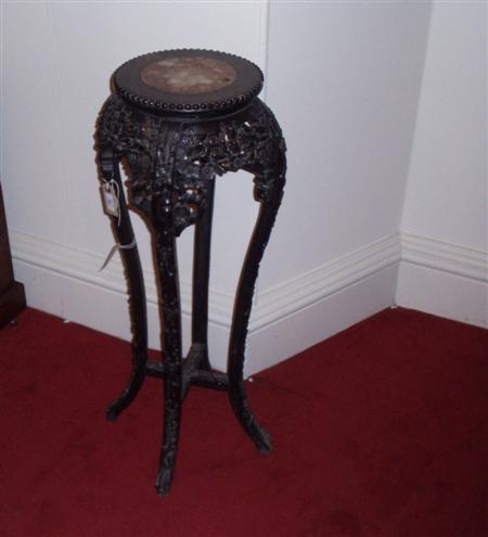 Appraisal: An Oriental carved hardwood jardiniere stand the beaded circular top