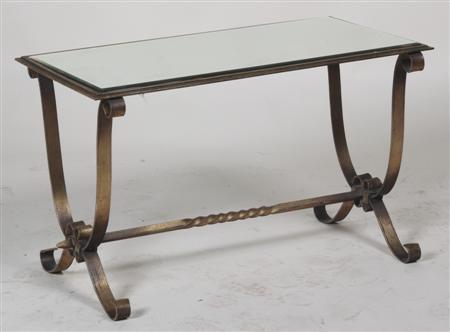 Appraisal: A low glass top table the rectangular top raised on