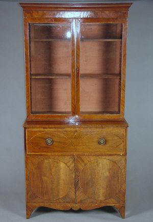 Appraisal: A George III mahogany and inlaid secretaire bookcase the cavetto