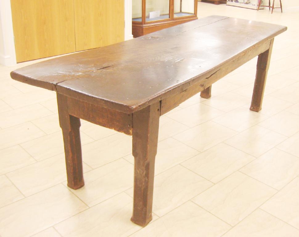 Appraisal: An early oak Refectory Table with thick single plank top