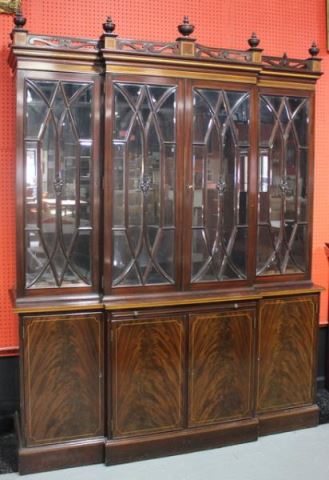 Appraisal: POTTHAS Mahogany Breakfront A beautiful cabinet with beveled glass inlay