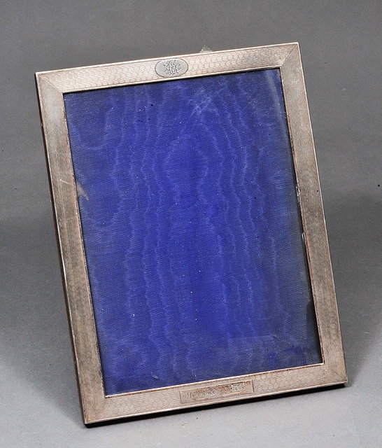 Appraisal: A RECTANGULAR SILVER PORTRAIT FRAME with engine turned decoration high