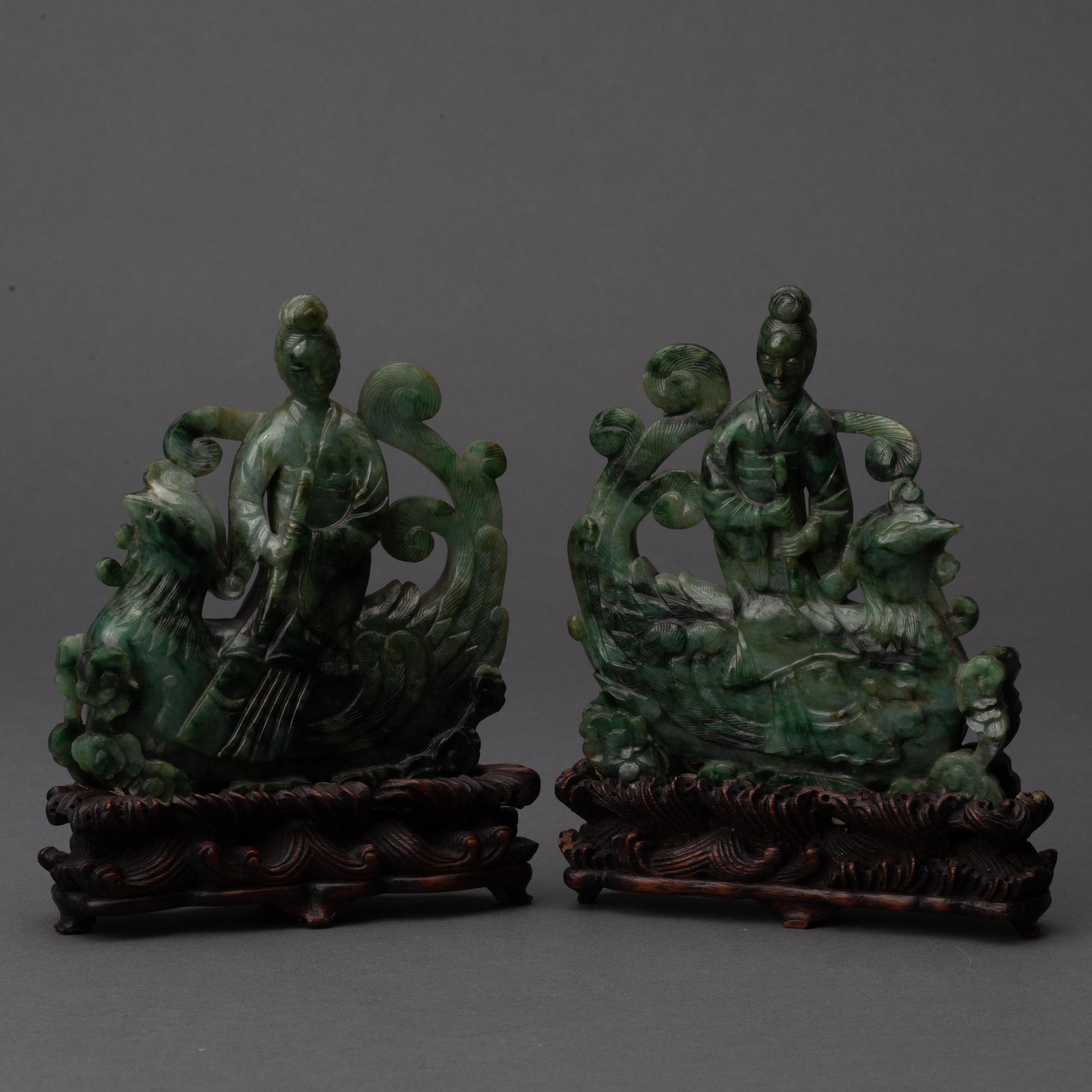 Appraisal: PAIR OF CARVED CHINESE SAUSSURITE IMMORTALS TH TH CENTURY Spinach-green