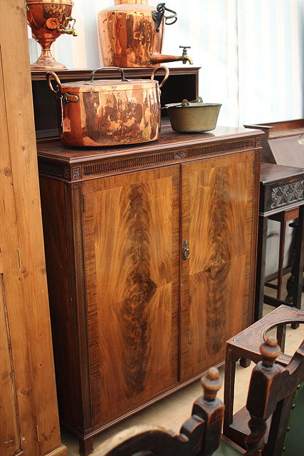 Appraisal: A MAHOGANY WARDROBE CUPBOARD BY HEAL'S the raised upper section