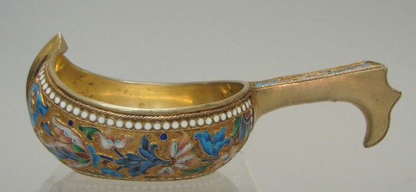 Appraisal: Multicolored floral decoration on gold ground conforming handle side touchmark