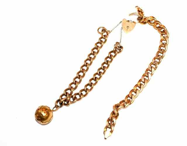 Appraisal: A CT GOLD CURB LINK BRACELET with an attached charm