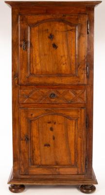 Appraisal: A th Century French walnut bonnetiere the central drawer with