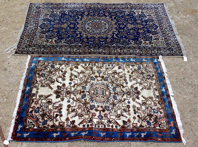 Appraisal: TWO TH CENTURY CARPET RUGS one with a blue border