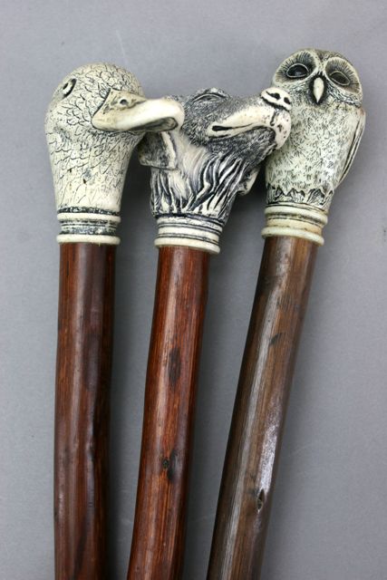 Appraisal: Three bamboo walking sticks the handles formed as animal heads