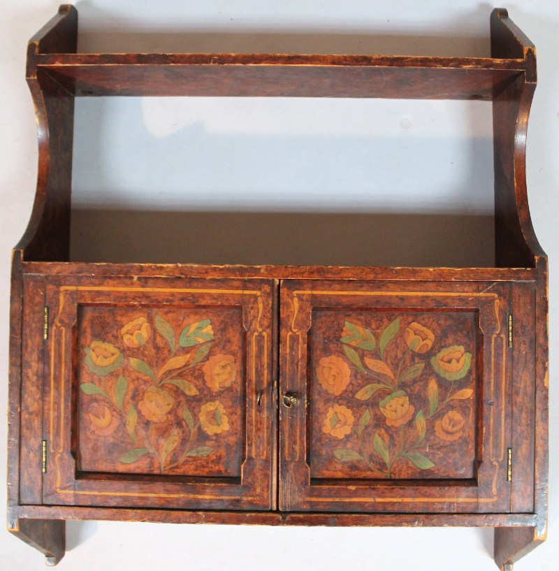 Appraisal: An early thC painted pine hanging cabinet with upper shelf