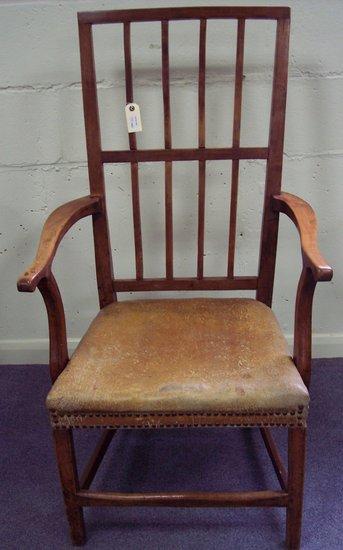 Appraisal: A fruitwood armchair with vertical splats to the back having