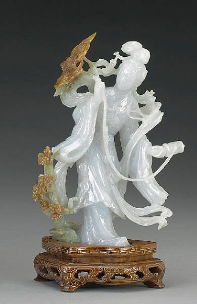 Appraisal: A pale green and russet jadeite beauty th Century The