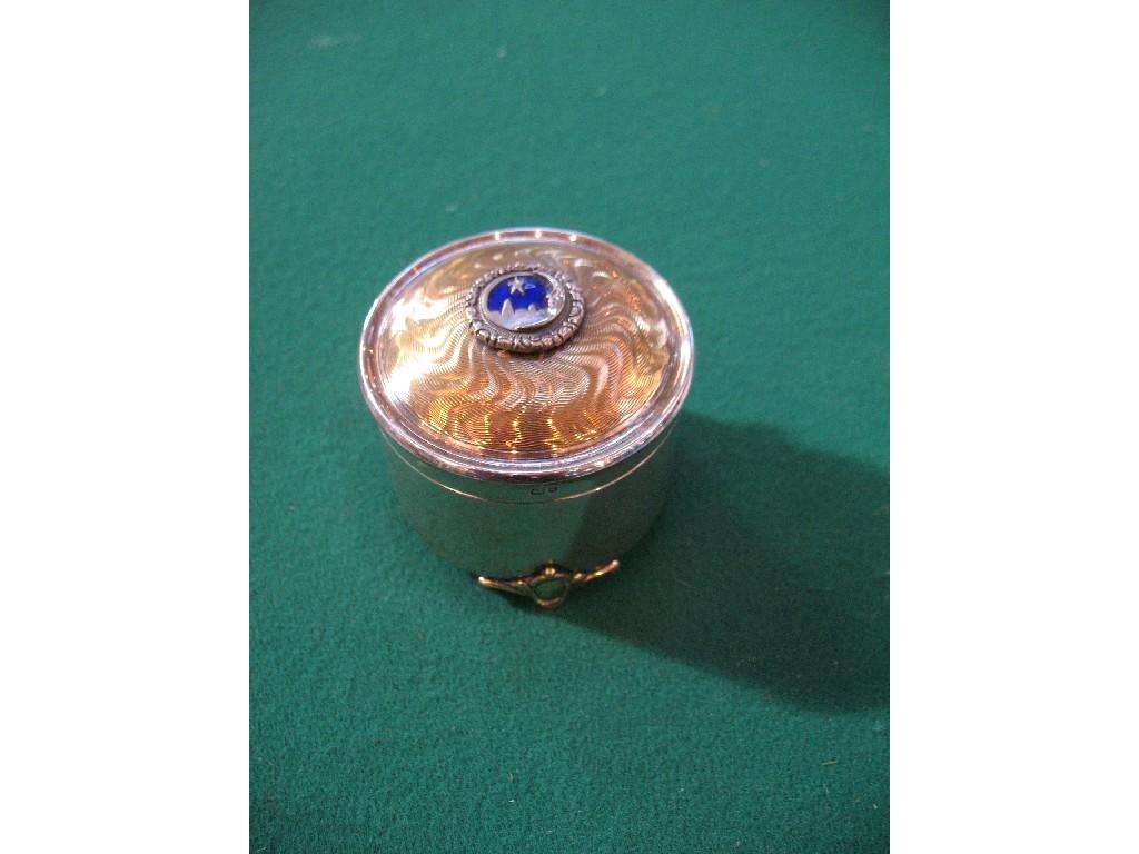 Appraisal: A CIRCULAR SILVER MUSIC BOX the top with engine-turned and