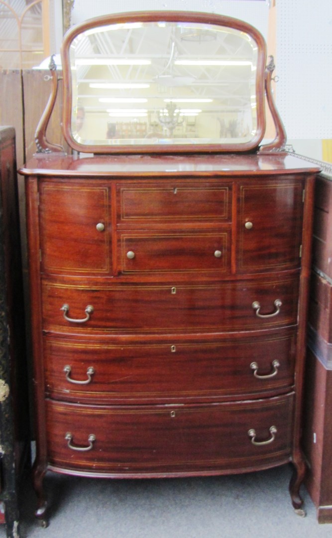 Appraisal: A late th century brass inlaid mahogany bowfront chest with