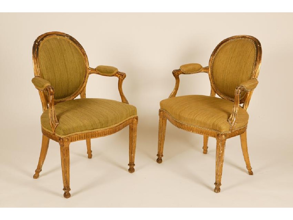 Appraisal: A PAIR OF GEORGE III GILTWOOD ARMCHAIRS of neo-classical design