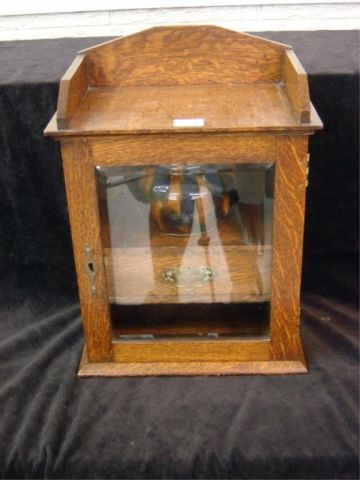 Appraisal: OAK BEVELED GLASS PIPE CABINET