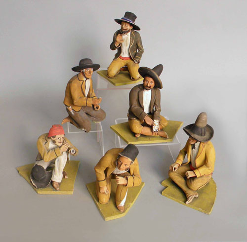 Appraisal: Six Mexican pottery figures together with a pottery gnome carved