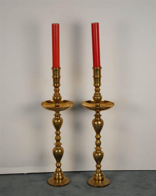 Appraisal: A Monumental Pair of Brass Candlesticks having round feet baluster