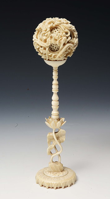 Appraisal: AN OLD CHINESE CARVED IVORY PUZZLE BALL on stand with