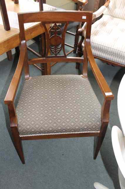 Appraisal: A CONTINENTAL MAHOGANY ELBOW CHAIR with splat back and a