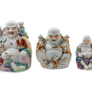 Appraisal: Three Famille Rose Porcelain Figures of Buddhas each molded seated