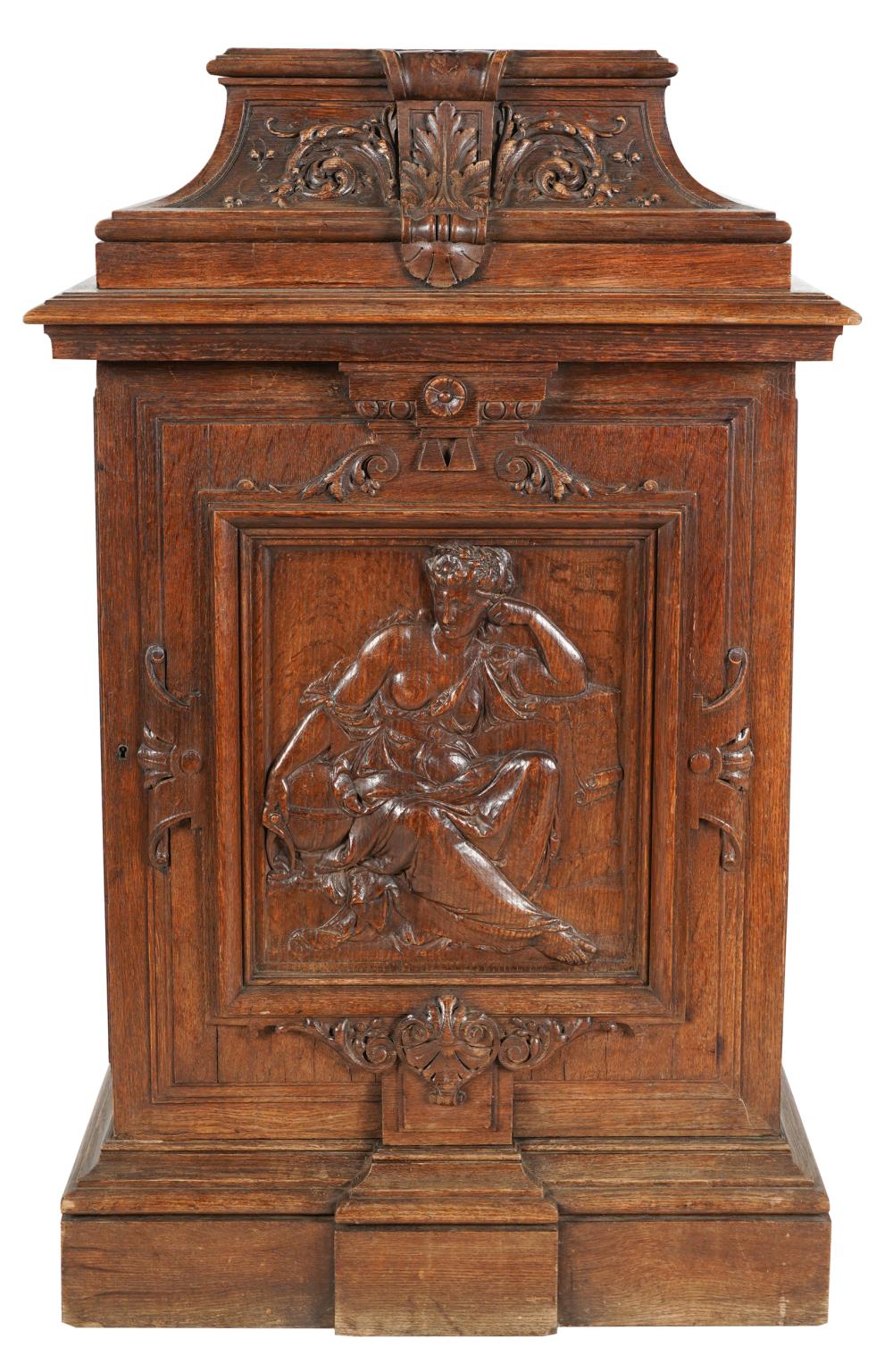 Appraisal: CONTINENTAL CARVED OAK PEDESTAL CABINEThaving a hinged door enclosing a