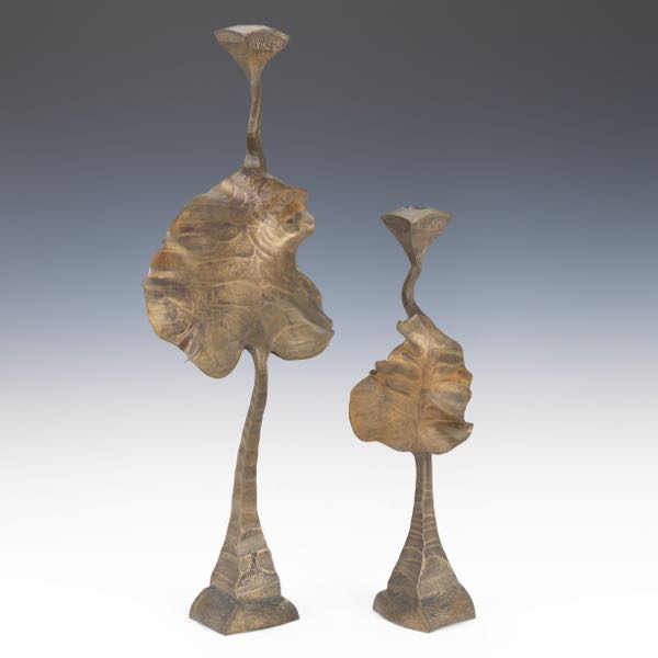 Appraisal: JACK BRUBAKER AMERICAN CONTEMPORARY Two bronze candlesticks Sculptural abstract leaf