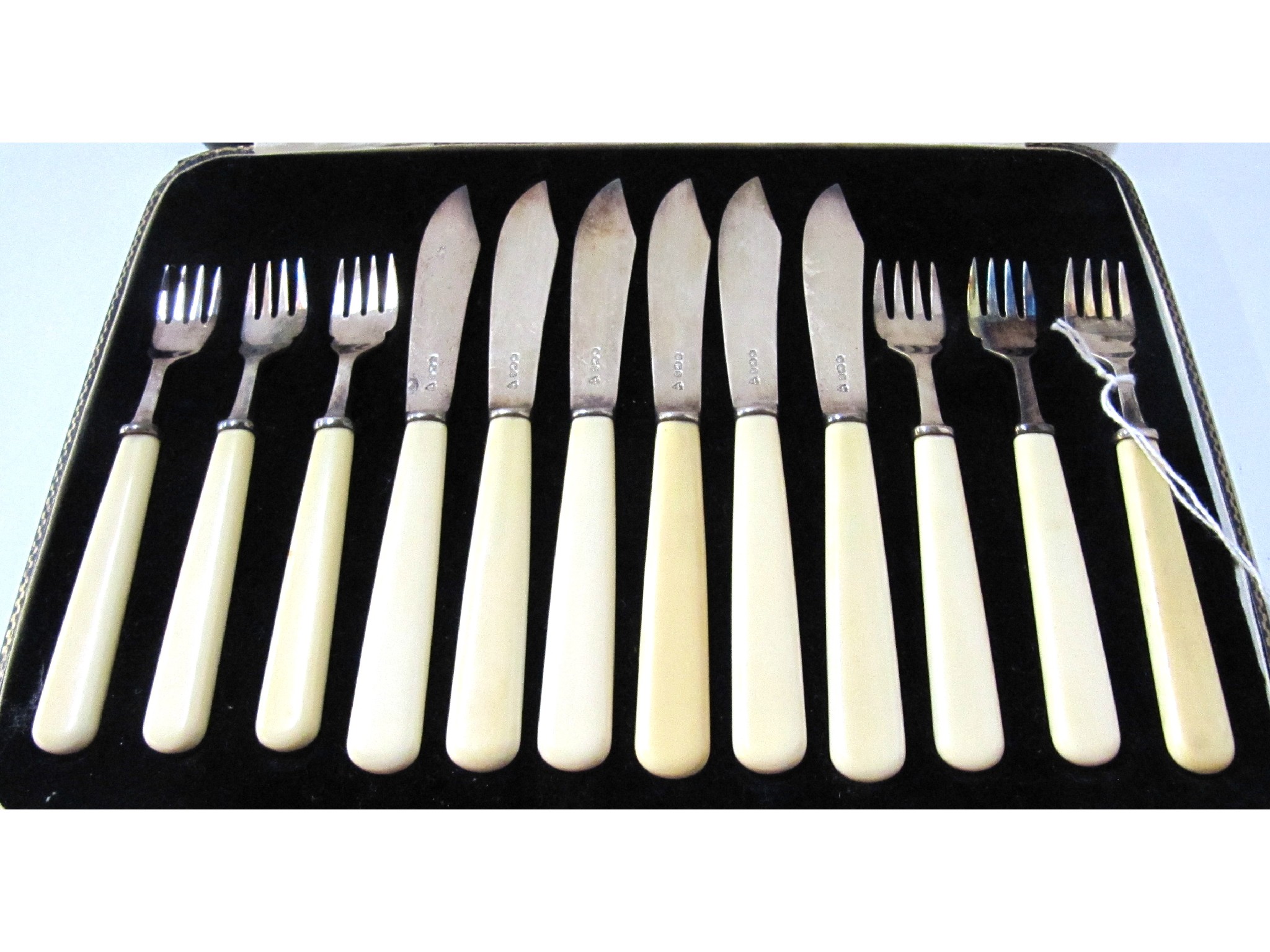 Appraisal: A cased twelve piece silver and bone handled cheese cutlery